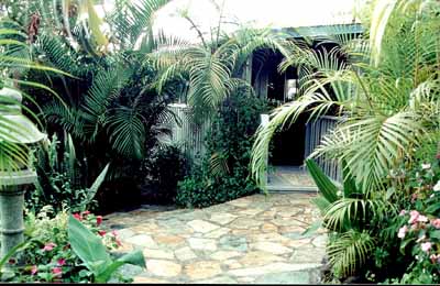 Relax and enjoy the view from the lovely living room in the two bedroom Hawaiian Bungalow